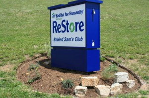 ReStore sign, rock and flower landscaping